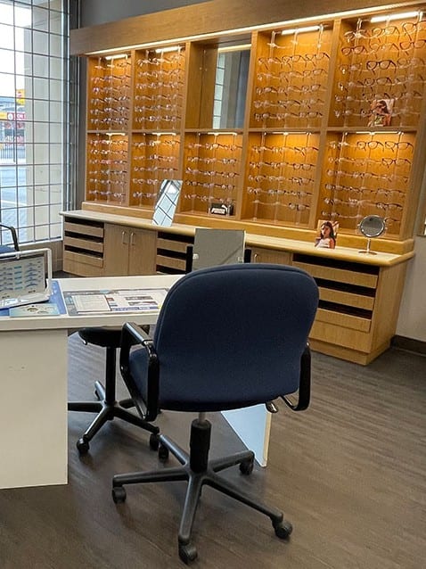 The frame and sunglass wall and fitting desk at Surrey Optometry